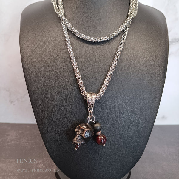 Silver skull and garnet charm necklace