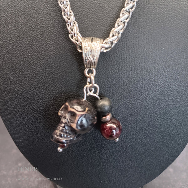 Silver skull and garnet charm necklace