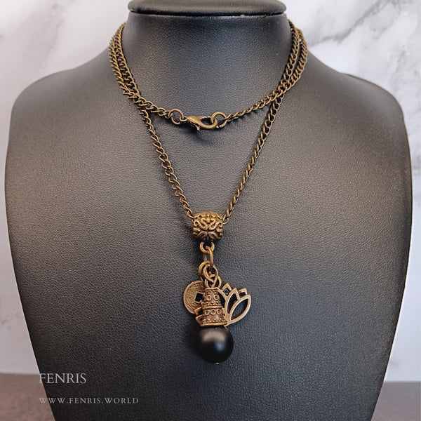 bronze lotus and coin charm necklace with black obsidian