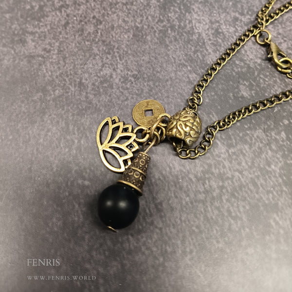 bronze lotus and coin charm necklace with black obsidian